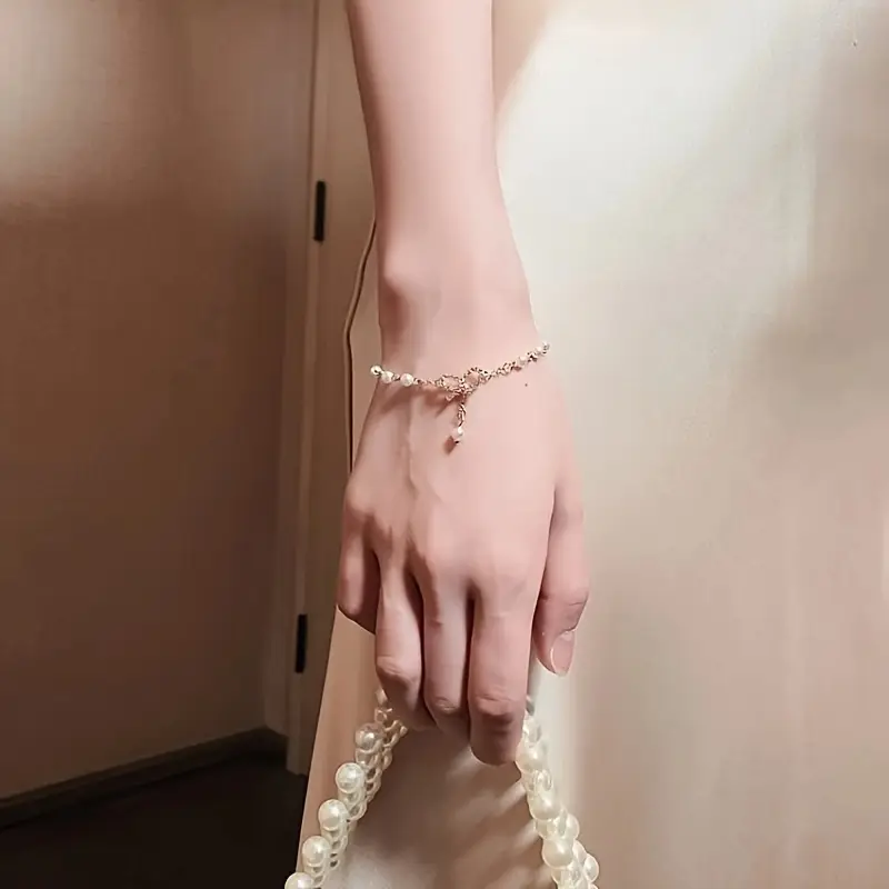 دستبند زنانه پاپیونی زیبا و مروارید کد 3181 (54-5.22-50)