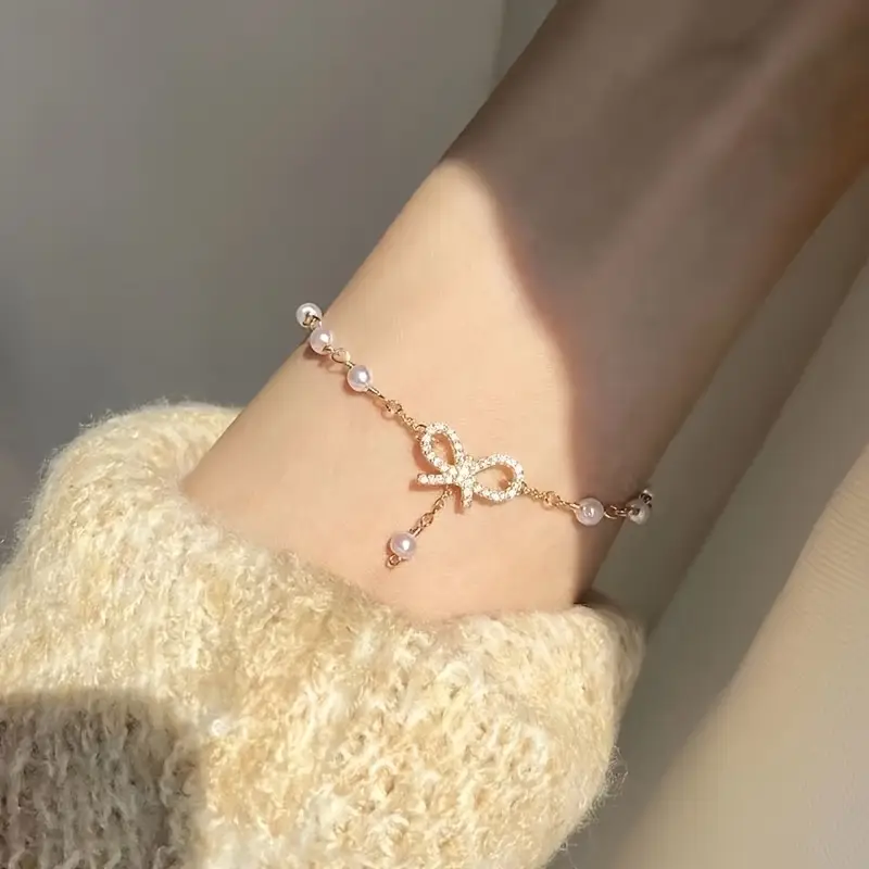دستبند زنانه پاپیونی زیبا و مروارید کد 3181 (54-5.22-50)